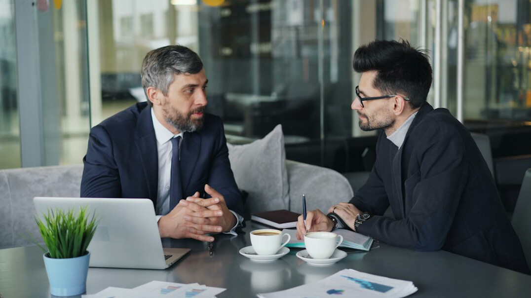 business people negotiating table