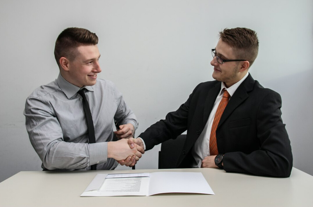 two professionals shaking hands